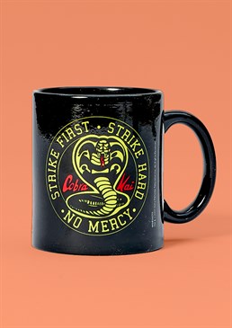 Strike first, strike hard, no mercy! This 11oz mug features the unmistakable emblem of everyone's favourite dojo - Cobra Kai. With a black background and inner, this is the perfect gift for fans of the 80's Karate Kid films and the smash-hit new Netflix series!
